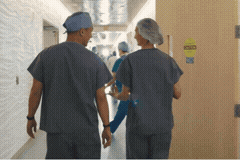 Medical staff walking a hospital hallway in a VR lecture scene